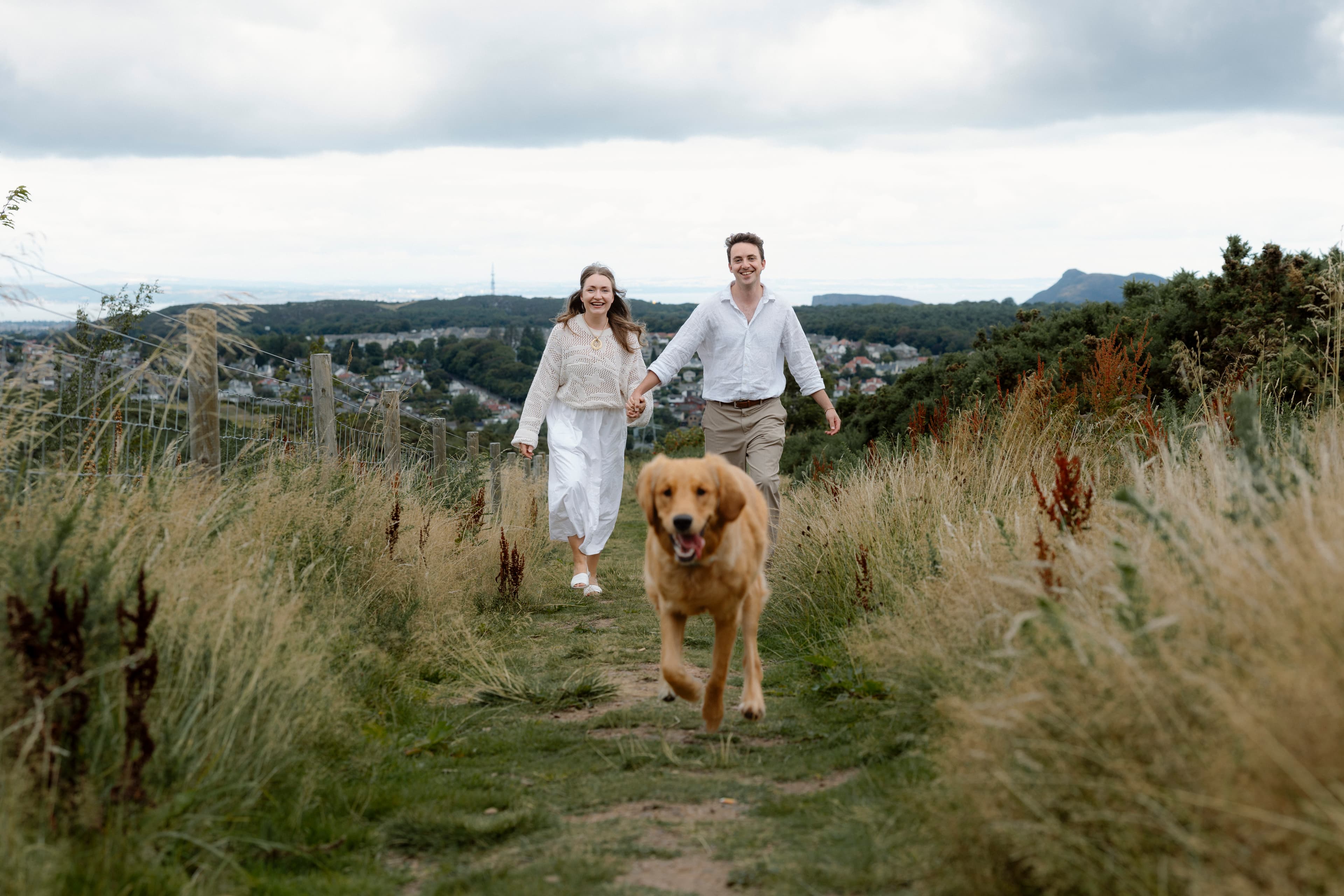 Daniel and Marta laughing with their dog